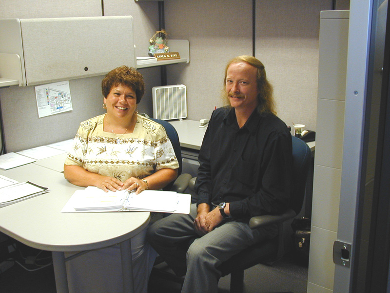 Karen Byrd, manager of the External Relations Unit, is pictured with her assistant, Barry Gunnoe.