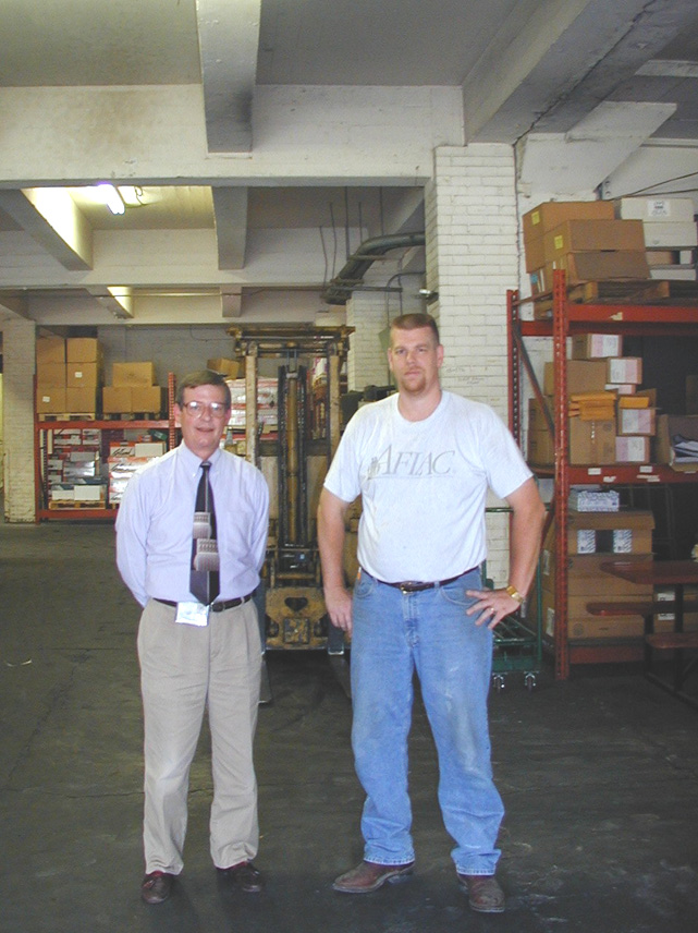 Correctional Industries' Director George Hampton is pictured with Steve Freed, Deputy Director, who supervised the renovation of the new warehouse facility on Leon Sullivan Way