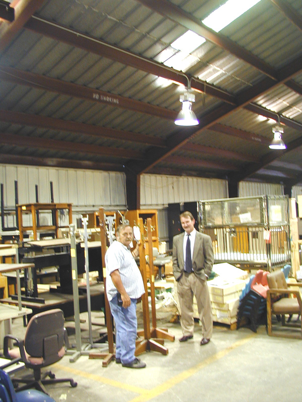 Federal Warehouse Supervisor Danny Layton (l) and Surplus Property Manager Ken Frye in the federal warehouse.