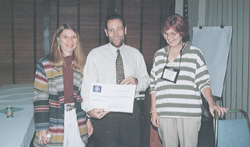 Who Wants to Be a Millionaire? At Purchasing version's of the game show, two Department of Administration employees hit the million dollar mark. Purchasing Director Dave Tincher holds the 'non-negotiable' million dollar check with the winners (l-r), Linda Lyter (FARS) and Diane Connelly (Accounting). 