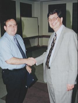 Buyer Supervisor Ron Price receives award from Cabinet Secretary Joseph Markus