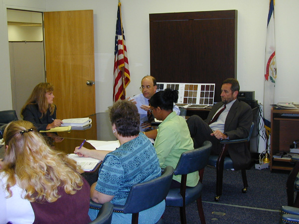Acting Cabinet Secretary Tom Susman (center) and Purchasing Director Dave Tincher (right) met with agency travel coordinators to gain their suggestions and comments regarding the proposed travel rules. Legislative Liaison Donna Prunty is accumulating the comments for submission.